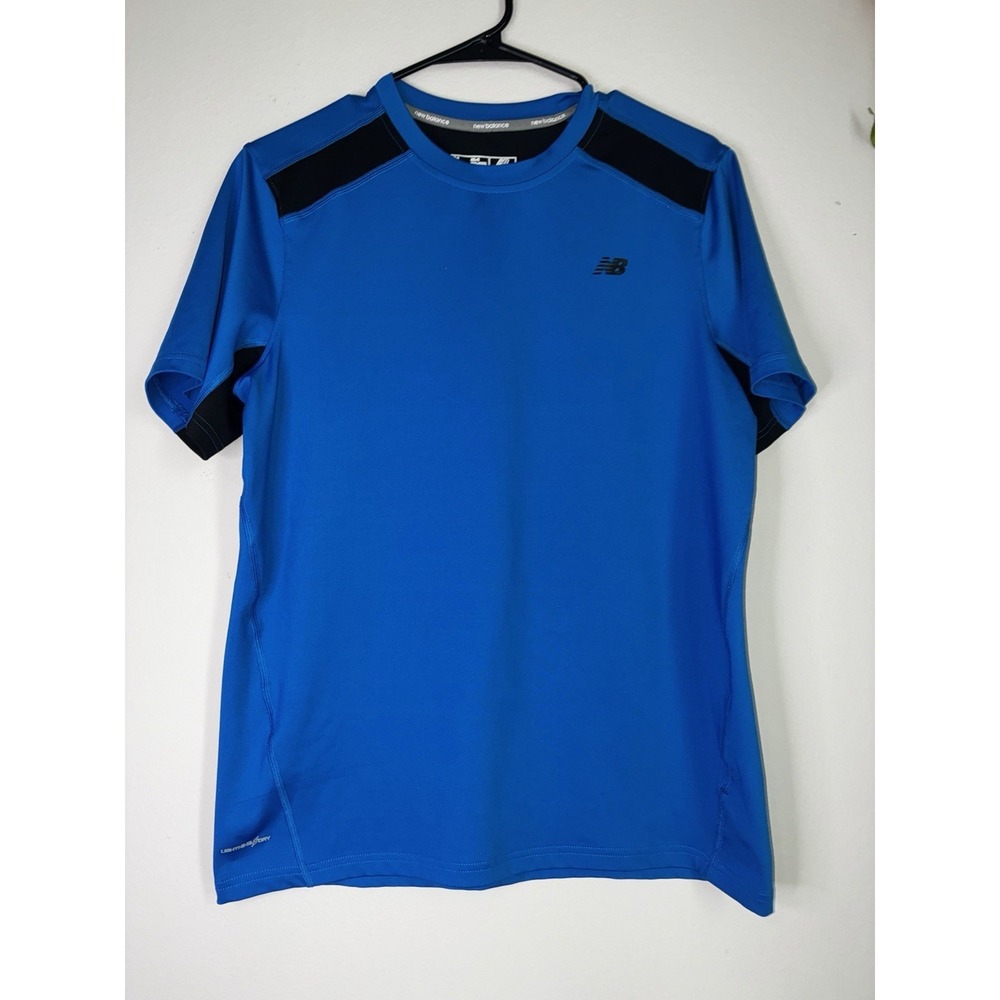 blue New Balance performance t-shirt with black shoulder panel